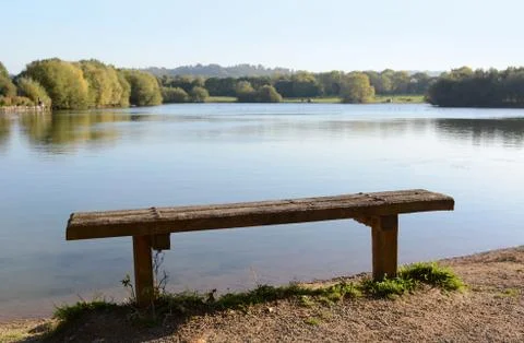 Rustic bench by a lake Stock Photos