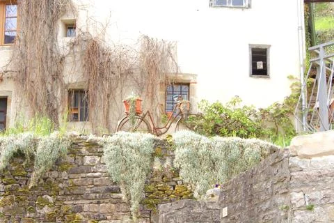 Rustic Bicycle Decor on Stone Wall Stock Photos