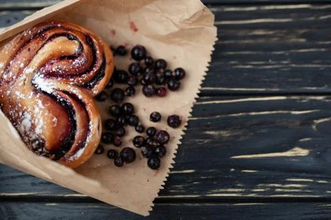Rustic with black current berry pie on black wooden background. 写真素材