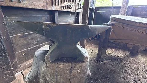 Rustic blacksmith anvil scene Stock Photos