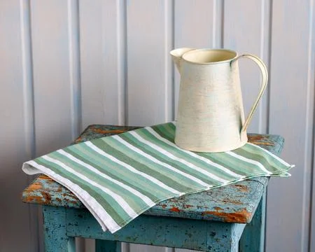 Rustic blue chipped stool with striped green white kitchen towel tin jug co.. Photos