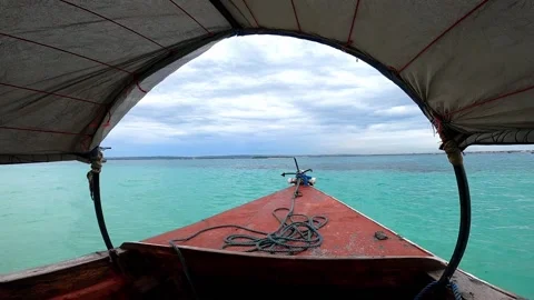 Rustic boat rocking on waves Stock Footage 134700743