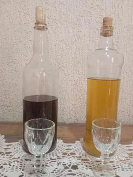 "Rustic bottles with liquids on decorated table" Stock Photos
