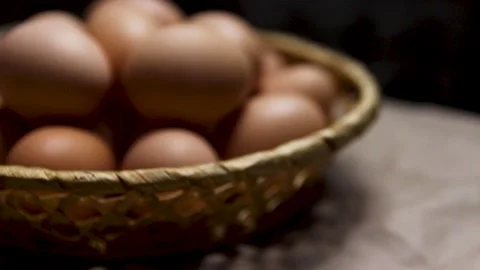 Rustic bowl collection of eggs on black background. Easter craft box with bro Stock Footage 170345558