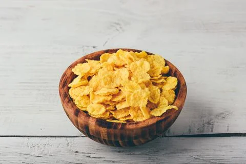 Rustic bowl of corn flakes Stock Photos