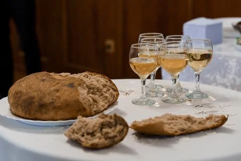 Rustic Bread and Elegantly Served White Wine at a Celebration Stock Photos