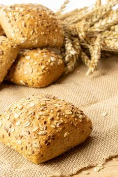 Rustic bread. Fresh loaf of rustic traditional bread with wheat grain ear or  Stock Photos