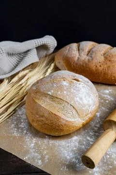 Rustic Bread Loaves with Wheat and Rolling Pin Stock Photos
