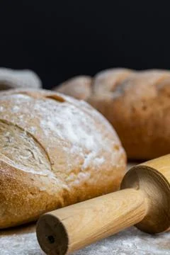 Rustic Bread Loaves with Wheat and Rolling Pin Stock-Fotos
