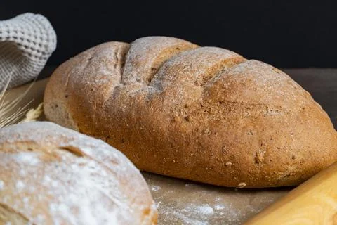 Rustic Bread Loaves with Wheat and Rolling Pin Stock Photos
