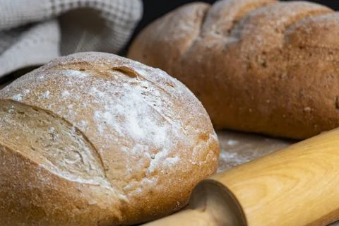 Rustic Bread Loaves with Wheat and Rolling Pin Stock Photos