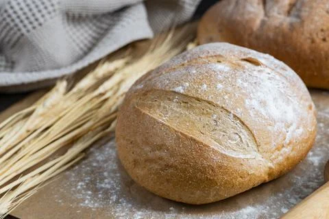 Rustic Bread Loaves with Wheat and Rolling Pin Stock Photos
