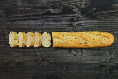 Rustic bread over dark wood Stock Photos