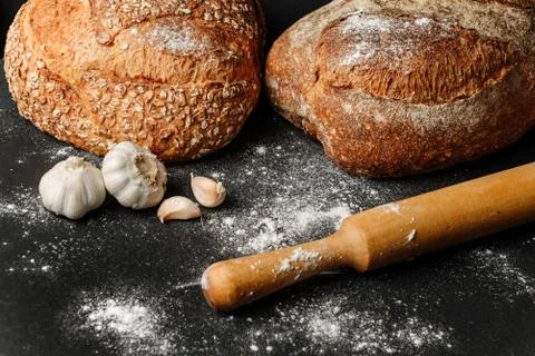 Rustic bread on a table sprinkled with flour Foto stock