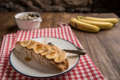 Rustic bread toast with peanut butter and banana Stock Photos