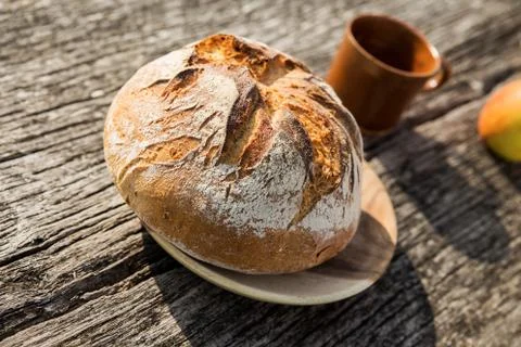 Rustic bread on wooden table Stock Photos