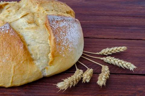 Rustic bread on wooden table Stock Photos