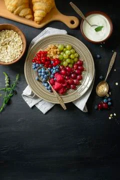 Rustic breakfast with fresh garden berries Stock Photos