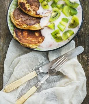 Rustic breakfast set with pancakes with strawberry yogurt and fr Stock Photos