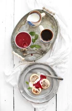 Rustic breakfast set. Russian cottage cheese pancakes or syrniki on a vintage Stock Photos