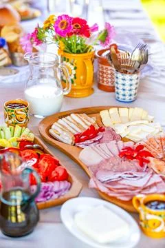 Rustic Breakfast Spread with Flowers Stock Photos