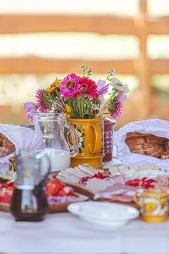 Rustic Breakfast Table with Flowers Stock Photos