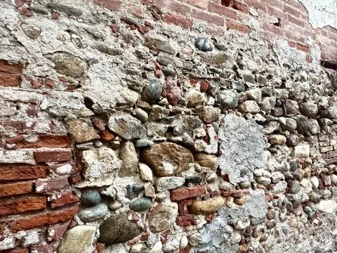 Rustic Brick and Stone Wall in Italian Old Town. Stock Photos