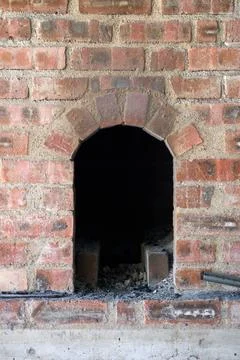 Rustic Brick Arch of a Traditional Forge or Kiln Opening Stock Photos