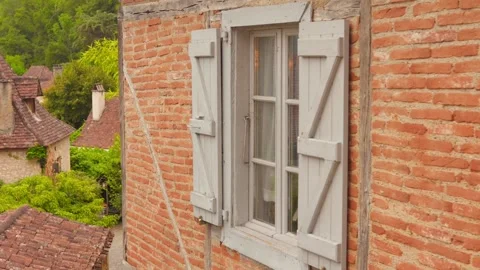 Rustic brick facade with window in Saint Cirq Lapopie Stock-Footage 318205348