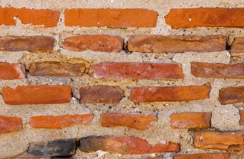 Rustic Brick Wall Displaying Warm Tones and Textured Surfaces Against a Neu.. Stock Photos