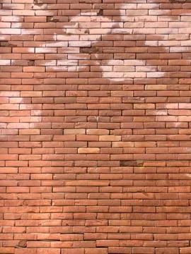 Rustic Brick Wall with Red and Orange Tones and Aged Texture Stock Photos