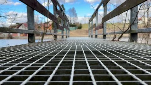 A Rustic Bridge Offering a Stunning View Overlooking a Serene and Peaceful .. Stock Photos