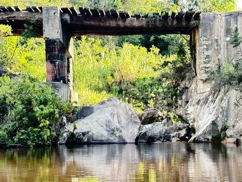 Rustic Bridge Over Calm River Stock Photos
