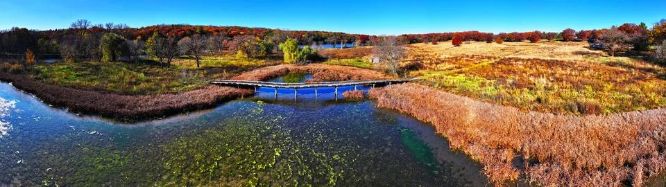 Rustic bridge on the Sugar River at Headgates park in Southern Wiscosnin Stock Photos