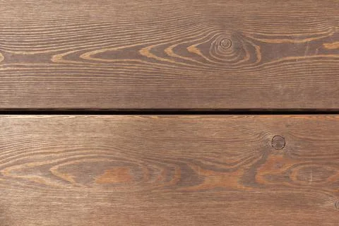 Rustic brown wooden plank table surface, front view, texture Stock Photos