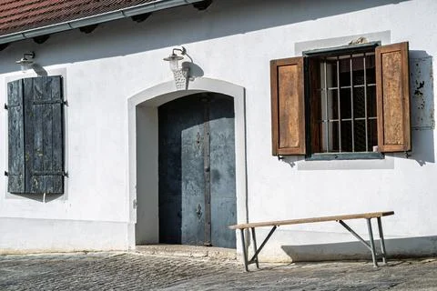 Rustic building with a bench. Фото