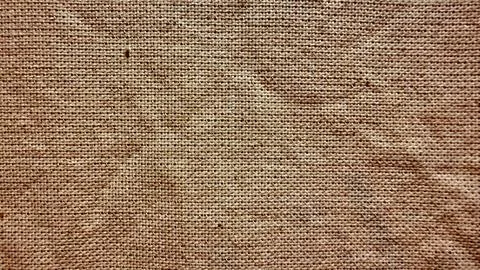 Rustic burlap weave closeup revealing coarse threads and earthy brown hues for Stock Photos