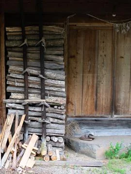 Rustic cabin with firewood Stock Photos