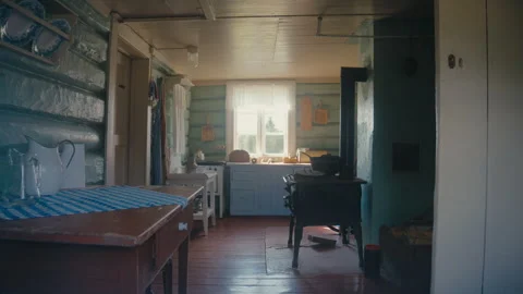 Rustic Cabin Kitchen Interior With Wood Stove and Window Light Stock Footage 334499365