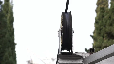Rustic cable car pulley wheel  rolling along a steel cable 動画素材 58748056