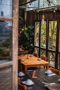 Rustic Cafe Interior with Set Tables Stock Photos