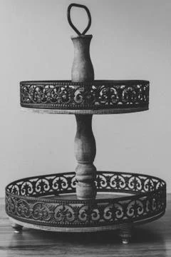 Rustic cake carrying stand in Black and White on table Stock Photos