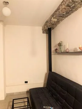 Rustic Ceiling and Cozy Couch from hotel Stock Photos