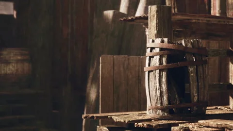 Rustic Charm in a Dimly Lit Barn With Wooden Barrels and Aged Crates Stock Footage 344821403