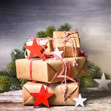 Rustic Christmas background with gift boxes Stock Photos