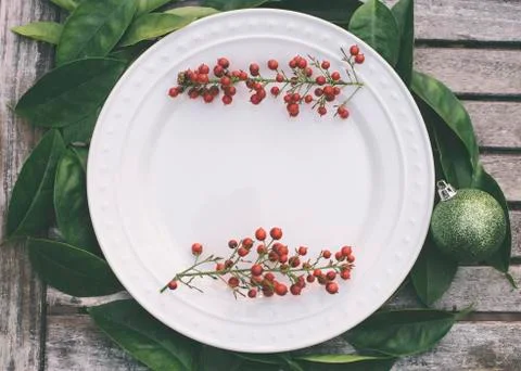 Rustic Christmas setting with red berries Stock Photos