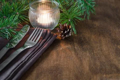 Rustic Christmas table setting with candle. Stock Photos