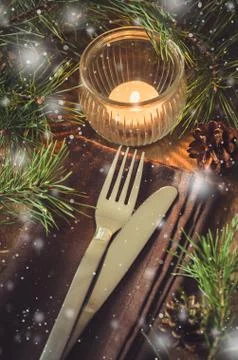 Rustic Christmas table setting with candle. Stock Photos