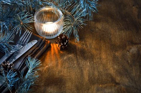 Rustic Christmas table setting with candle. Stock Photos