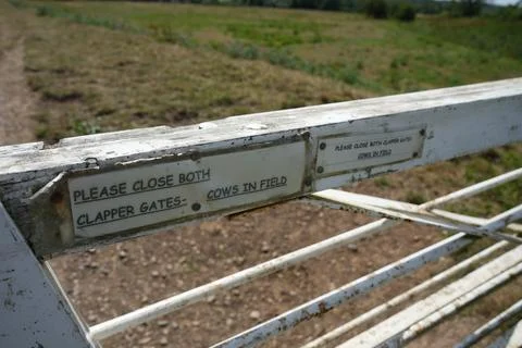 Rustic Clapper Gate Sign: Please Close Both Gates - Cows In Field Stock Photos